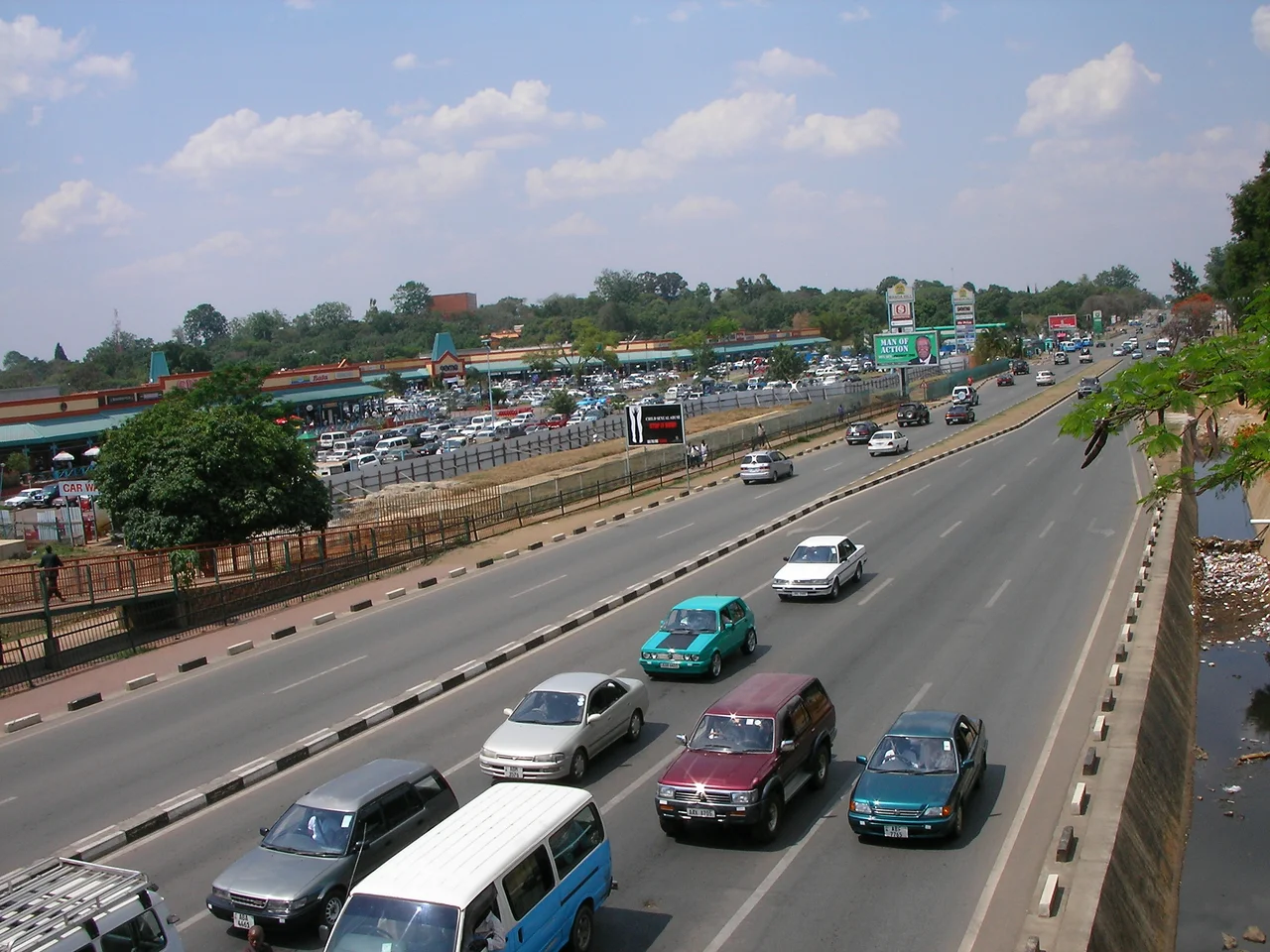 Looking northeast over the Great East Road in Lusaka, Zambia towards Manda Hill Shopping Centre. Photo is taken from pedestrian overpass at intersection of Great East Rd and Addis Ababa Drive.